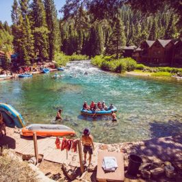 a group of people sitting at a beach