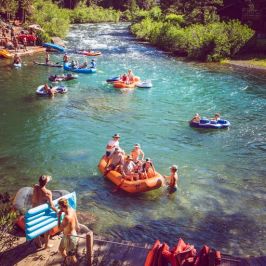 a group of people on a raft in a body of water