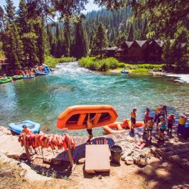 a group of people on a raft in the water