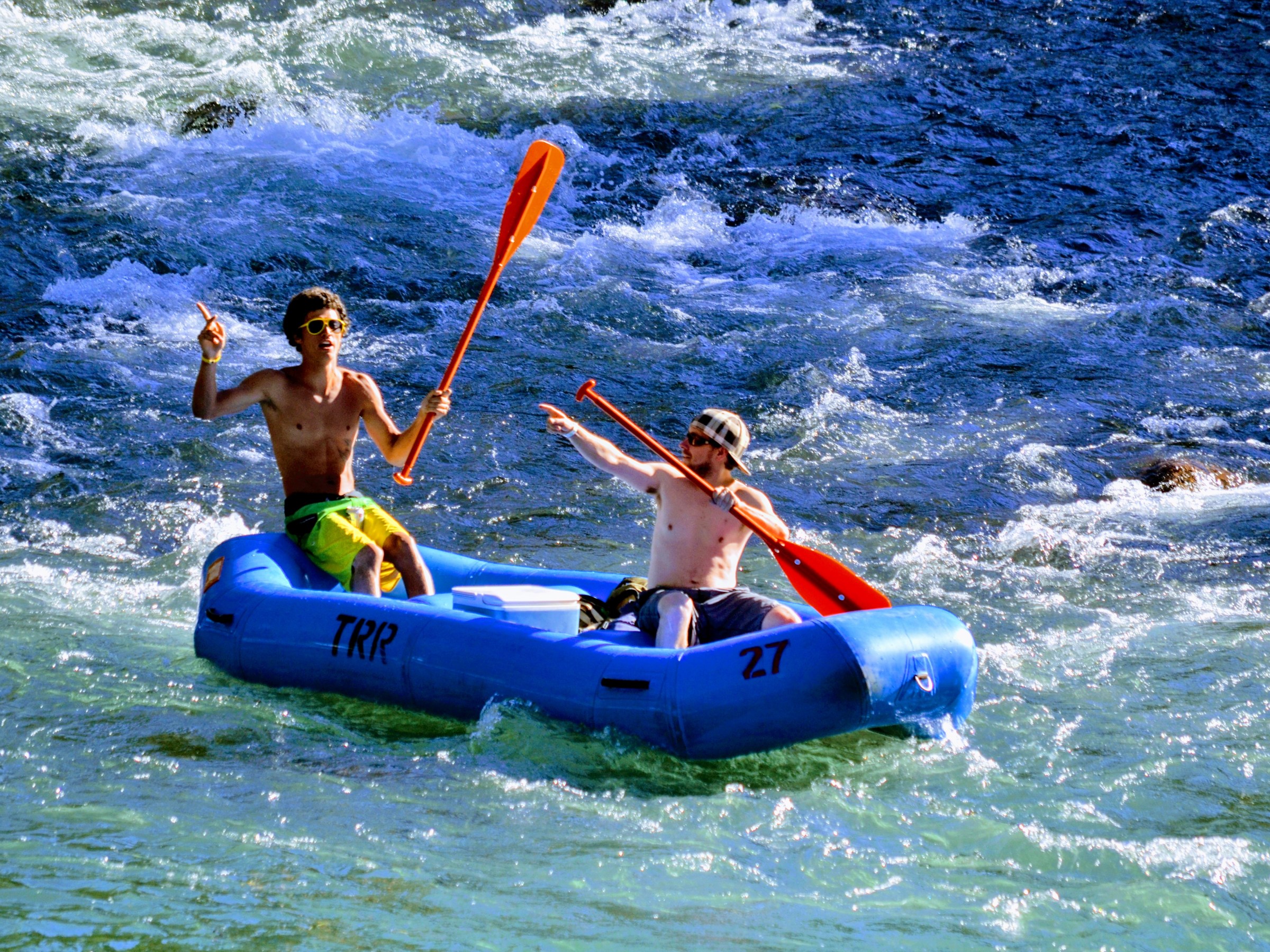 Two friends posing in a raft
