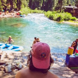 a group of people sitting at a beach